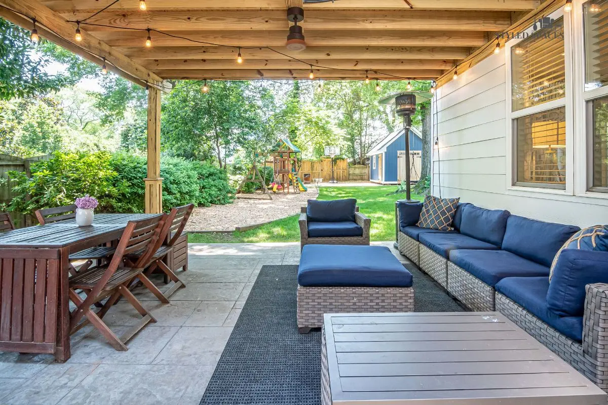 Outdoor rug grounding a patio seating and dining area