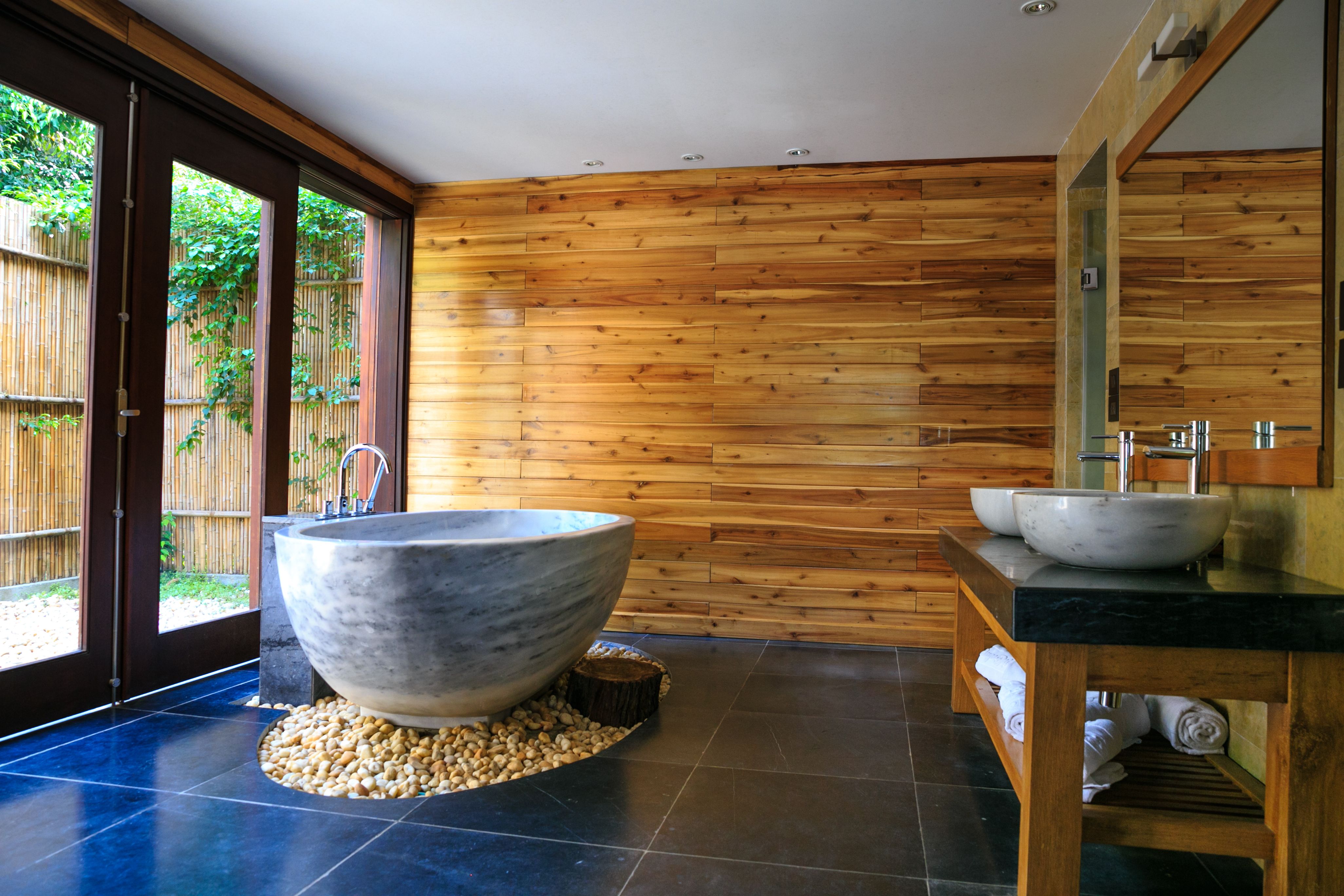 Bright, spa-like small bathroom with a large mirror and warm accents