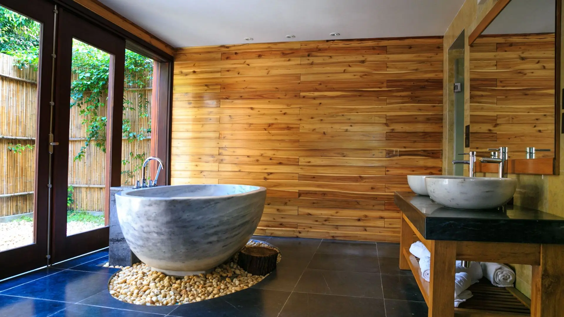 Bright, spa-like small bathroom with a large mirror and warm accents