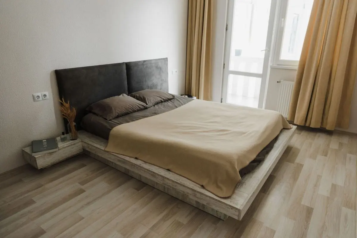 Low-profile platform bed frame in a modern bedroom