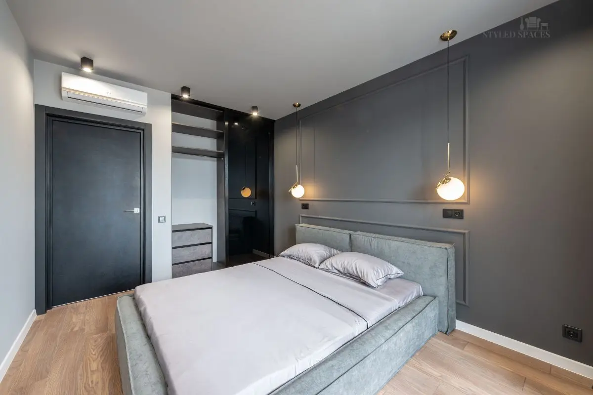 Bed floated at an angle in a small bedroom corner