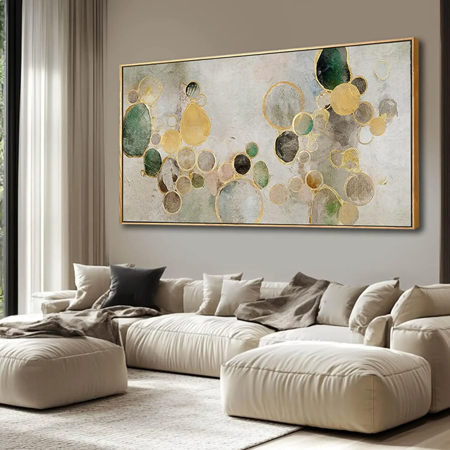 Large framed gold and green abstract circles canvas above a sofa