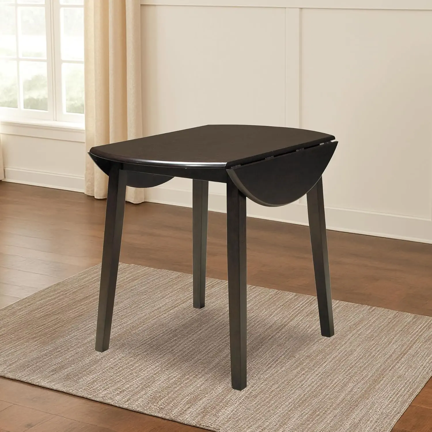 Ashley Hammis round drop-leaf dining table in dark wood
