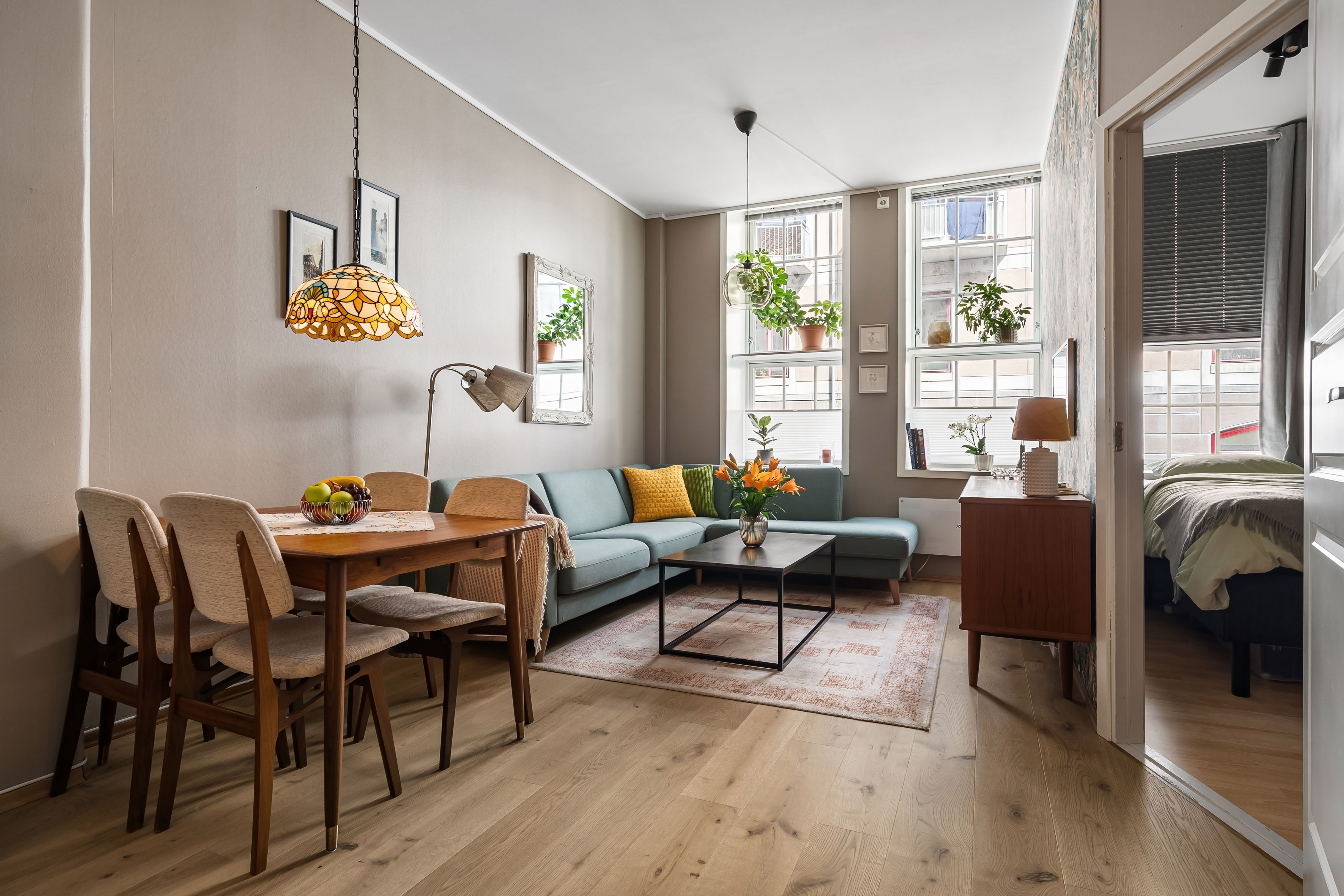 Bright, sage-toned living space styled by Styled Spaces