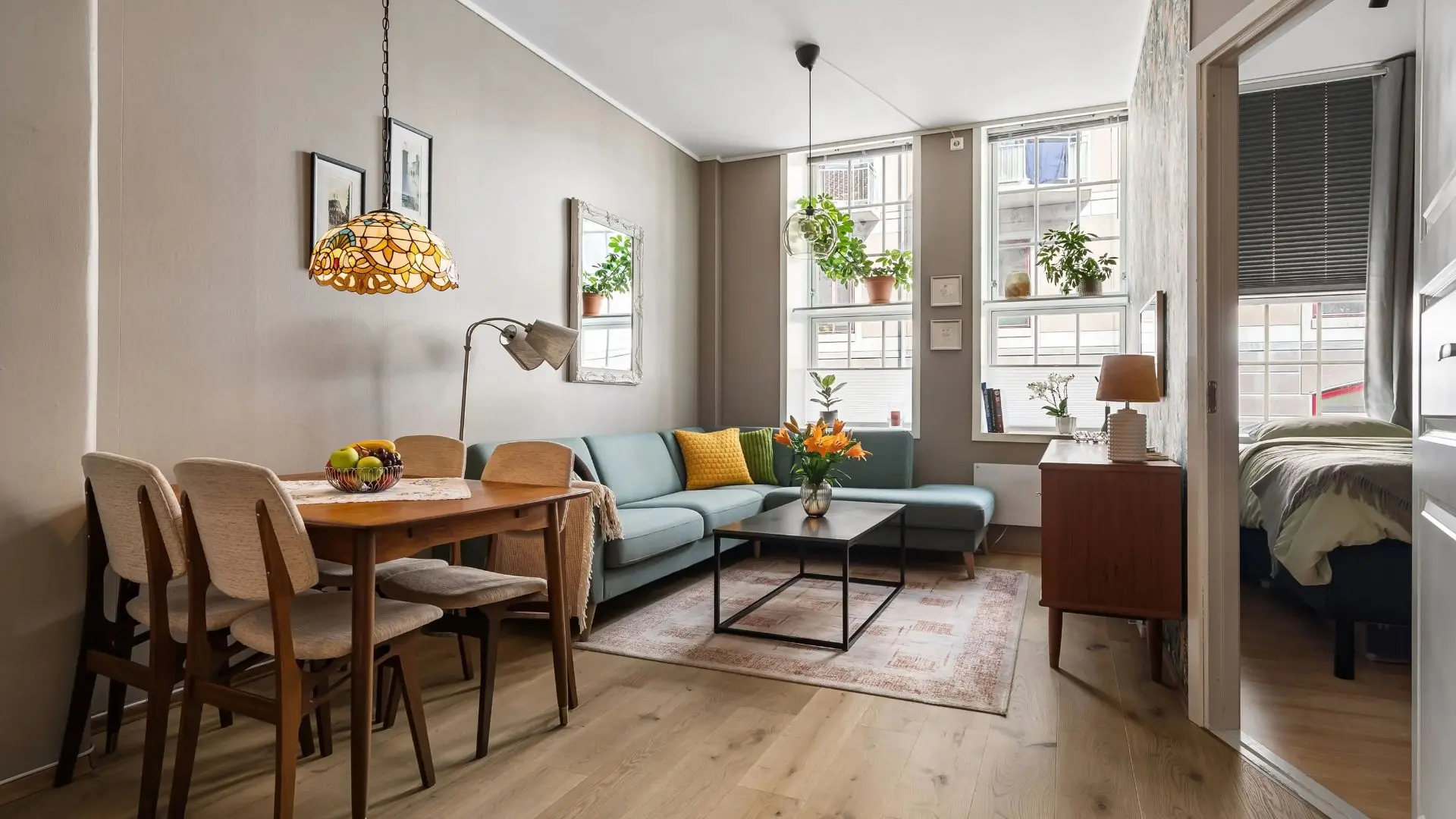 Bright, sage-toned living space styled by Styled Spaces