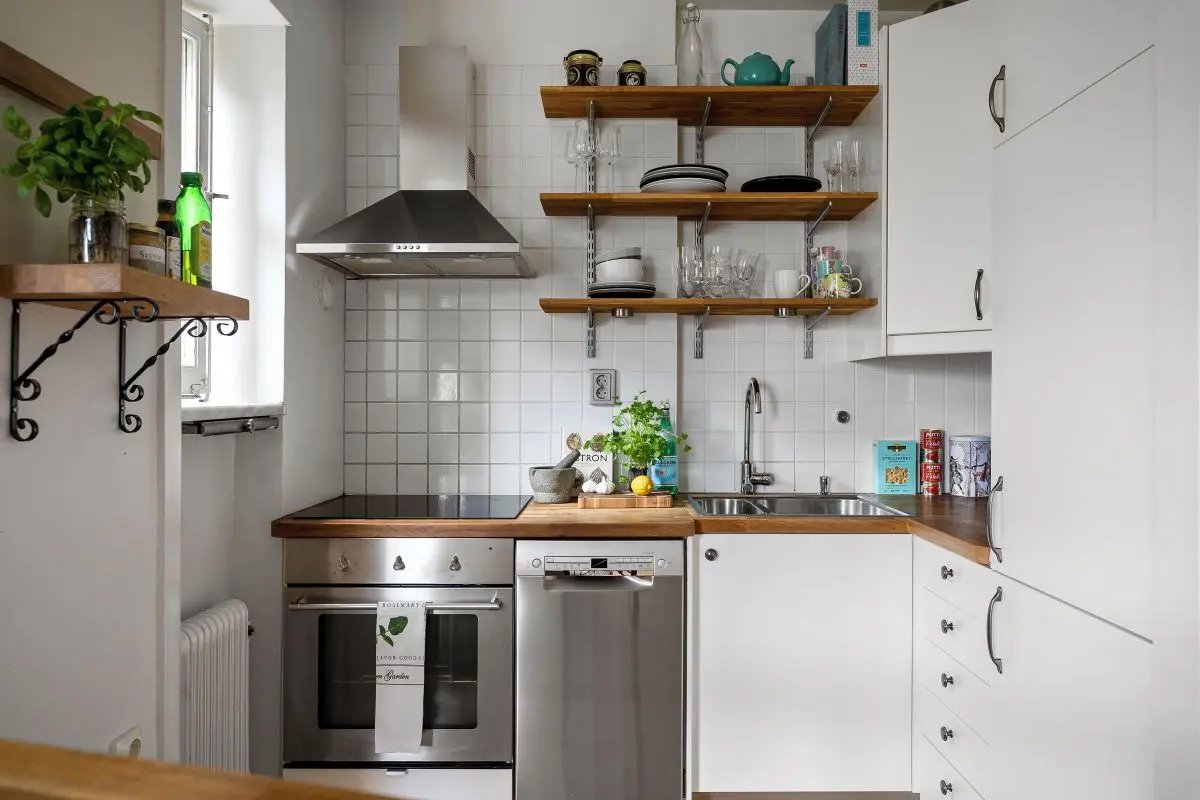Open shelving styled with dishes, jars, and glassware