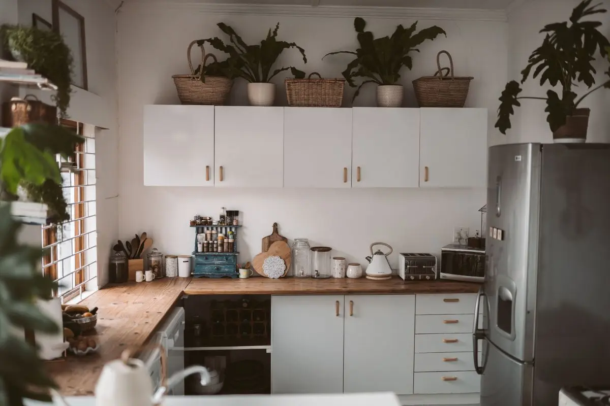 Baskets used for storage above kitchen cabinets