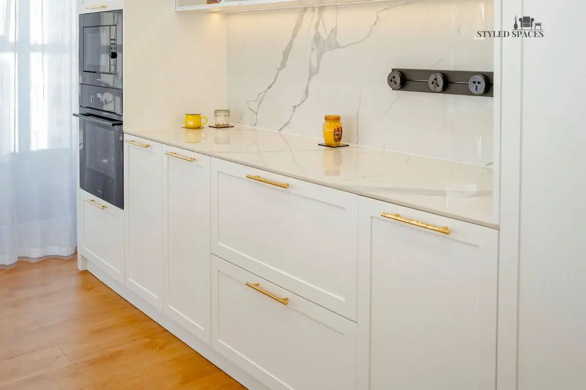 Kitchen cabinet hardware and finishes upgraded with textured metal pulls
