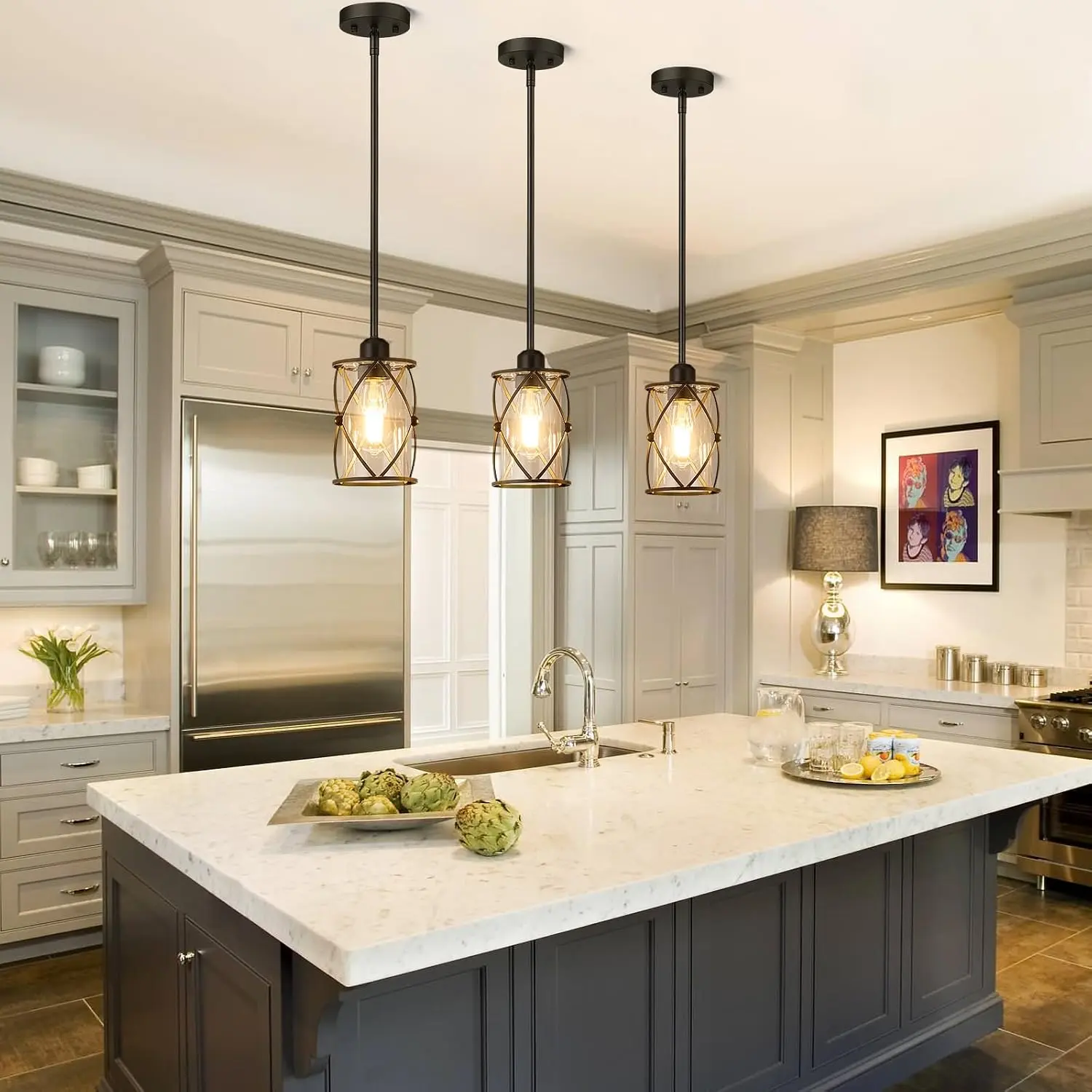 Osimir glass and black pendant lights over a kitchen island