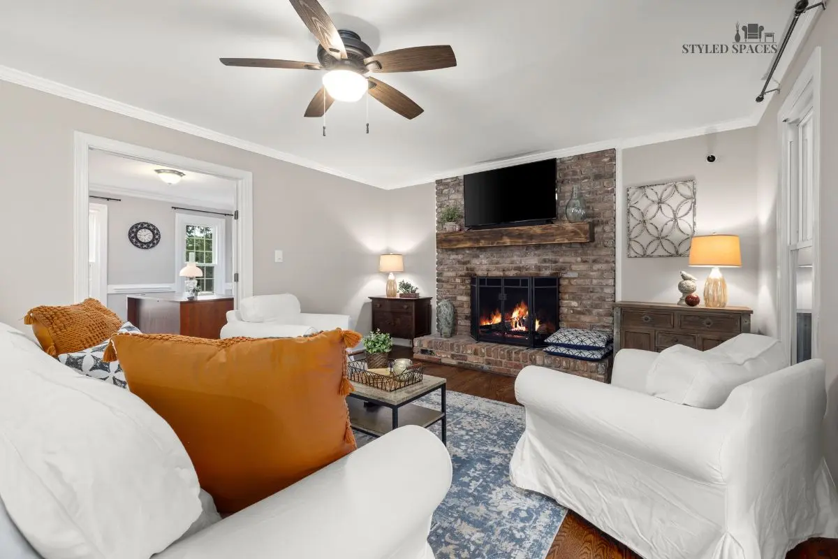 Dated brick fireplace wall updated with a clean painted mantel