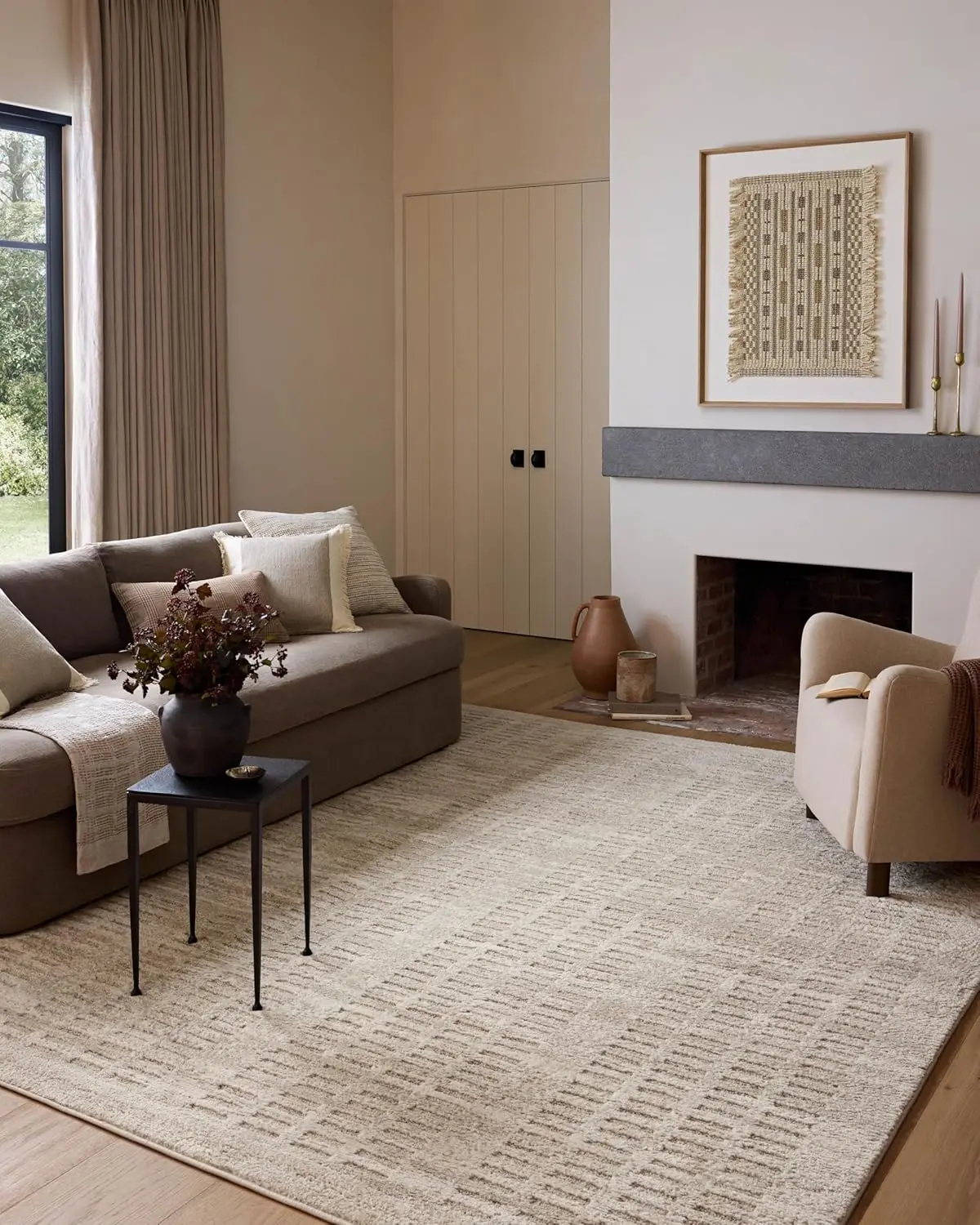 Loloi x Amber Lewis Monty ivory and taupe area rug in a neutral living room