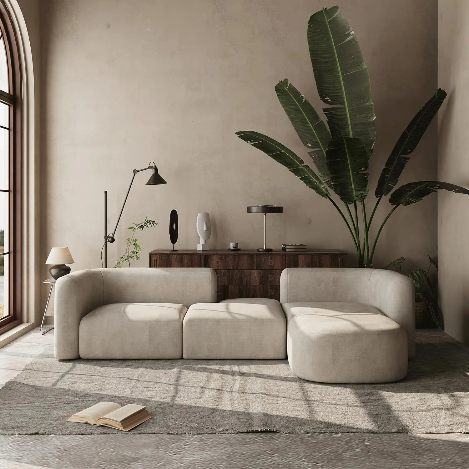 Acanva Mellow curved-back velvet sofa in a bright, neutral living room